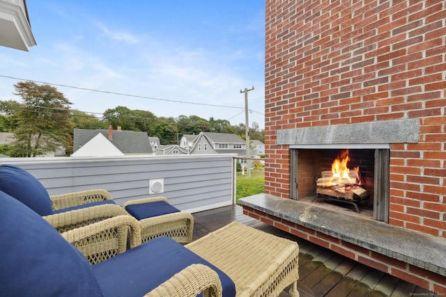 wooden deck featuring an outdoor fireplace