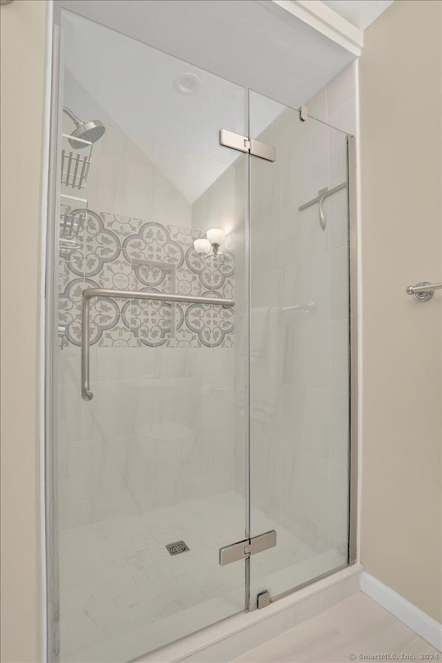 bathroom featuring tile patterned flooring and walk in shower