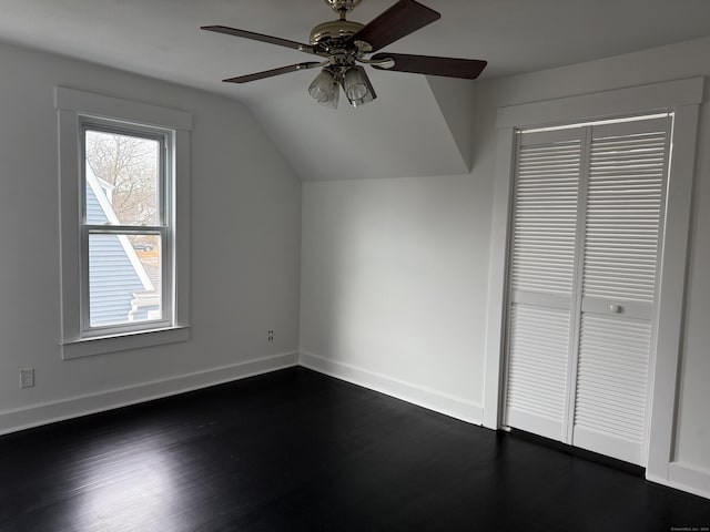 bonus room featuring ceiling fan, dark hardwood / wood-style floors, and vaulted ceiling