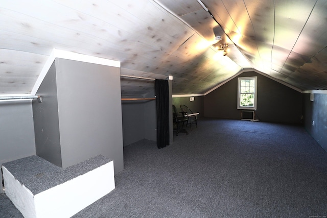 additional living space with carpet, wooden ceiling, and vaulted ceiling