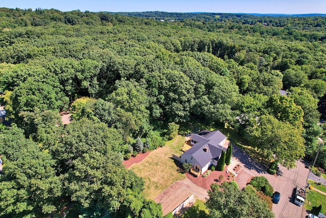 bird's eye view featuring a wooded view