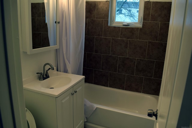 bathroom with shower / tub combo with curtain and vanity