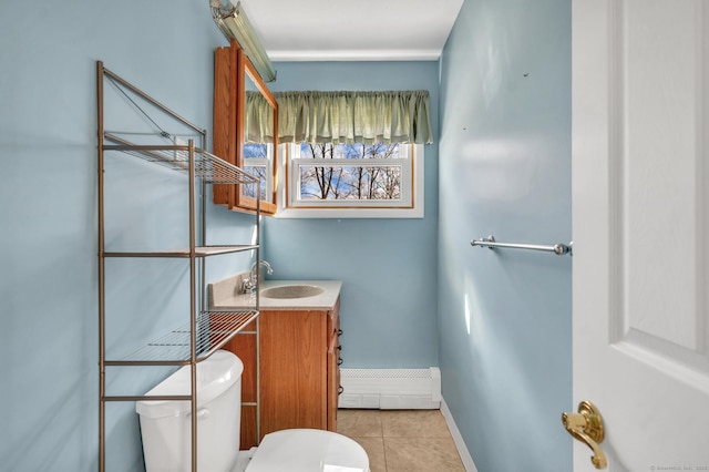 bathroom featuring tile patterned flooring, a baseboard radiator, vanity, and toilet