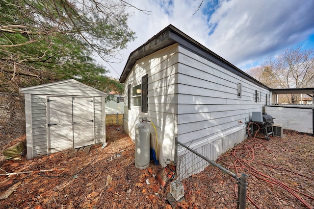 view of property exterior with a storage shed