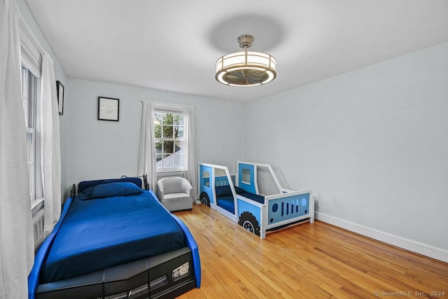 bedroom featuring wood-type flooring