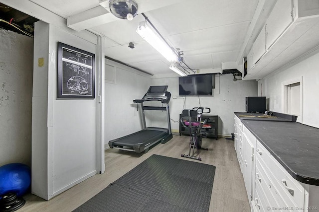 workout room with light wood-type flooring