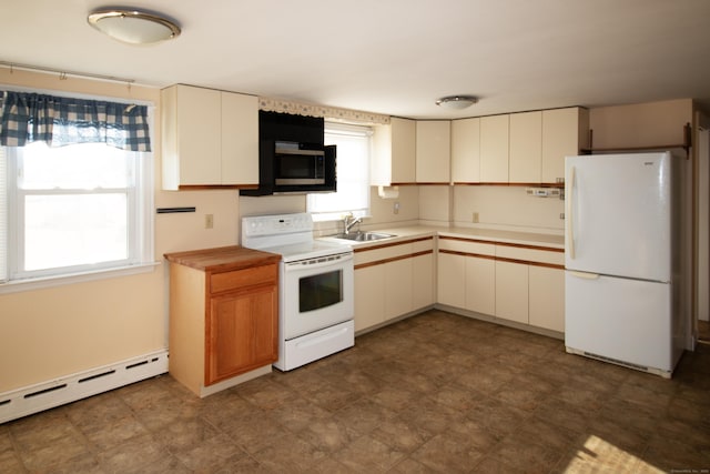 kitchen with sink, white cabinets, white appliances, and a baseboard heating unit