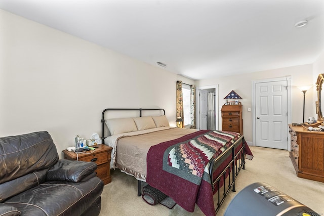 bedroom featuring light colored carpet