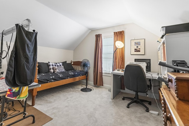 carpeted office featuring vaulted ceiling