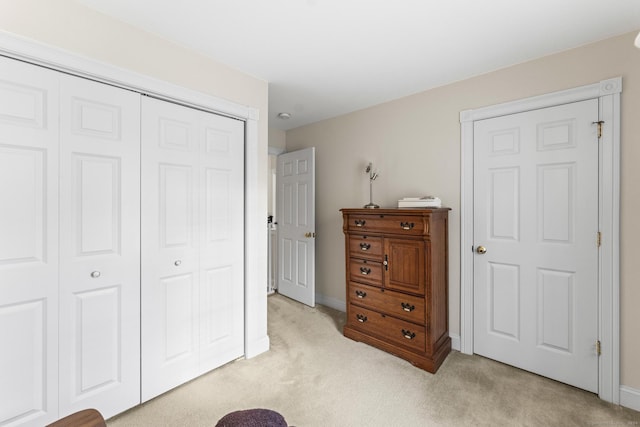 carpeted bedroom featuring a closet