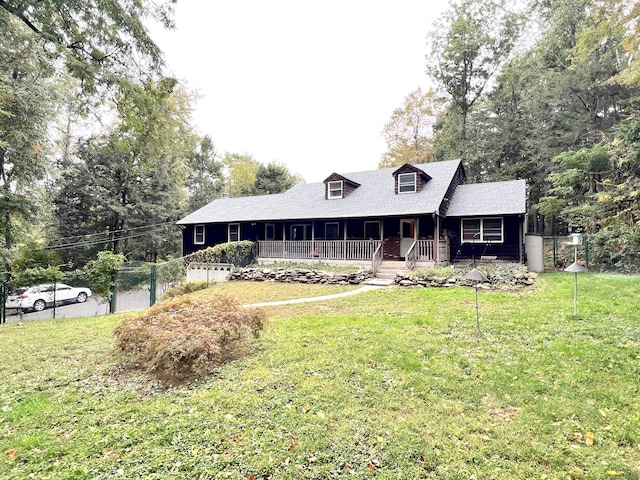 view of front of property with covered porch and a front yard