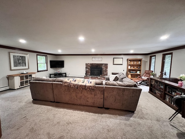 carpeted living room featuring crown molding and a baseboard heating unit