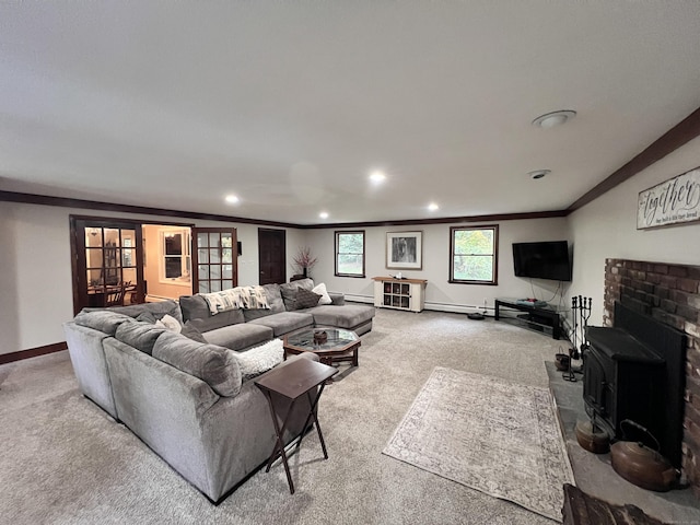 living room featuring carpet flooring, french doors, a wood stove, and ornamental molding