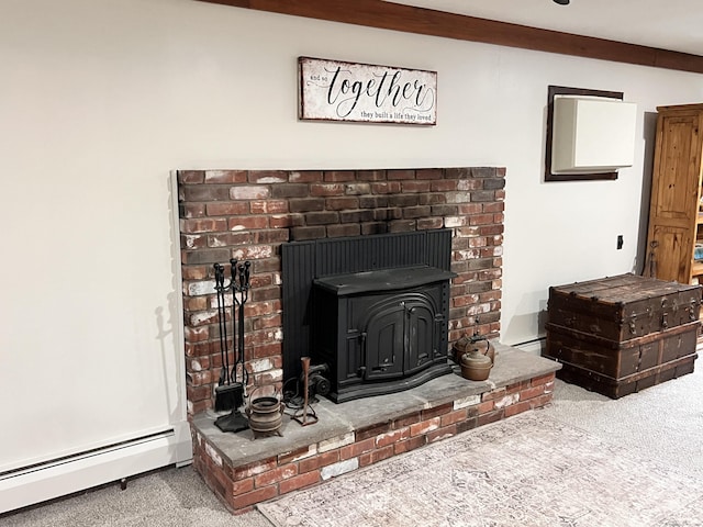 interior details featuring a wood stove, carpet, a baseboard radiator, and ornamental molding