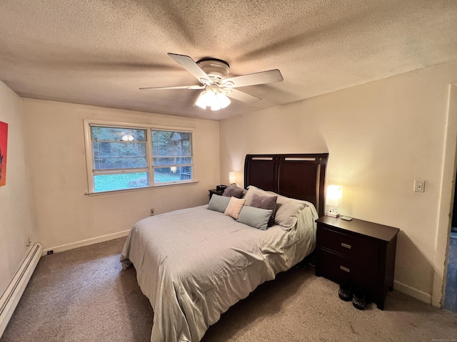 bedroom with carpet, a textured ceiling, baseboard heating, and ceiling fan