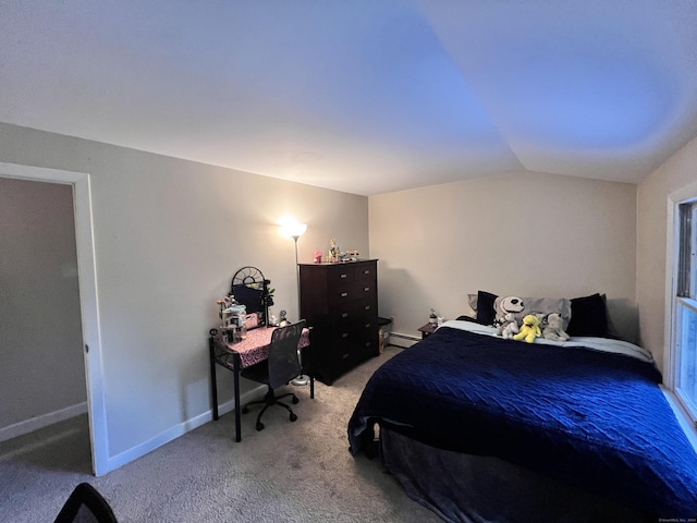 carpeted bedroom with lofted ceiling