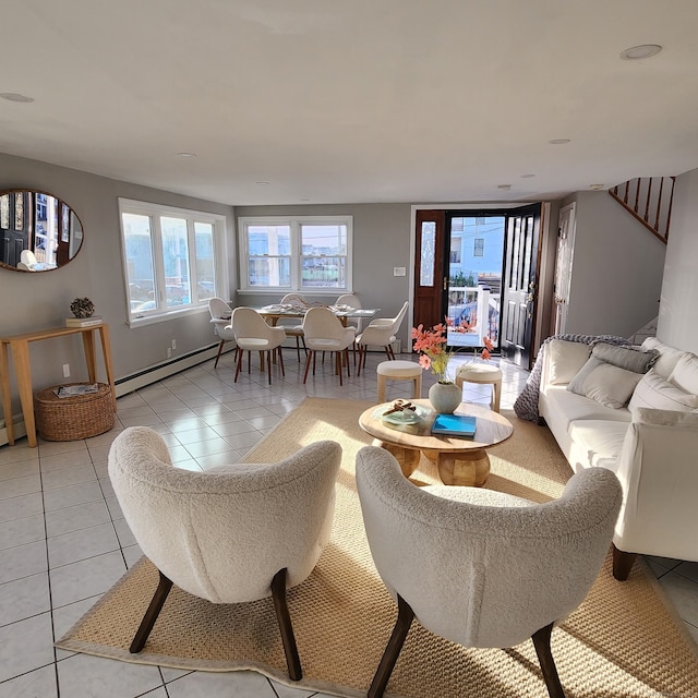 tiled living room featuring baseboard heating