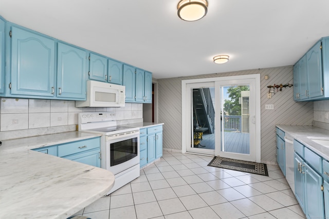 44 Washington Pkwy, Stratford, CT 06615 - kitchen with blue cabinets, light tile patterned flooring, tasteful backsplash, white appliances, and light countertops