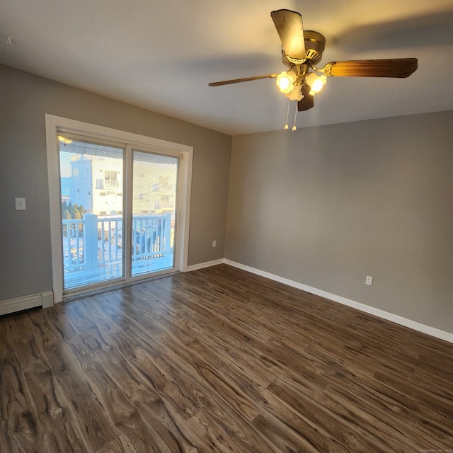44 Washington Pkwy, Stratford, CT 06615 - spare room with a baseboard radiator, dark wood-style flooring, a ceiling fan, and baseboards