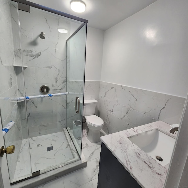 bathroom with vanity, toilet, and walk in shower