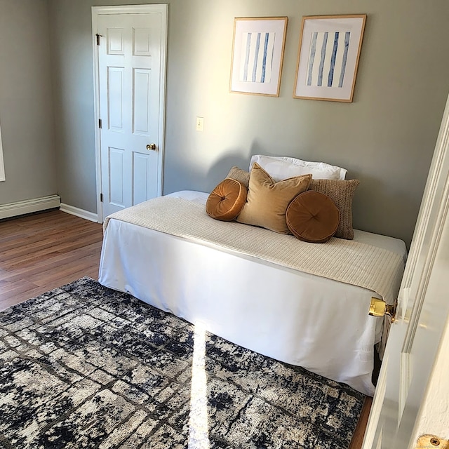 44 Washington Pkwy, Stratford, CT 06615 - bedroom featuring a baseboard radiator, baseboards, and wood finished floors