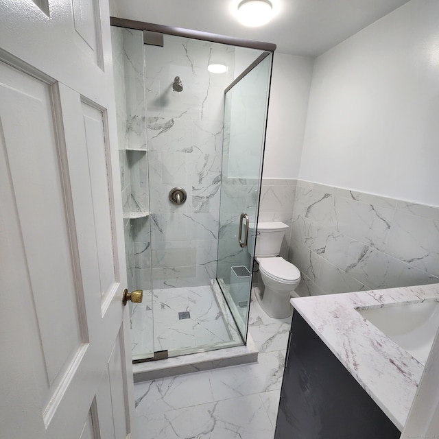 44 Washington Pkwy, Stratford, CT 06615 - full bath with a marble finish shower, vanity, marble finish floor, a wainscoted wall, and toilet
