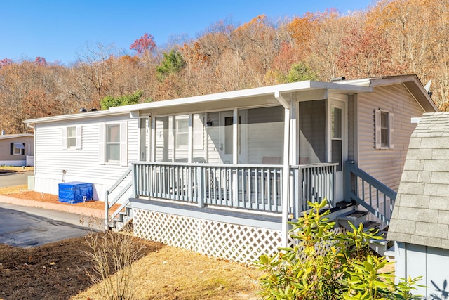 view of front of home with a sunroom