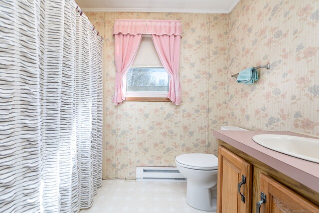 bathroom with a baseboard radiator, vanity, crown molding, and toilet