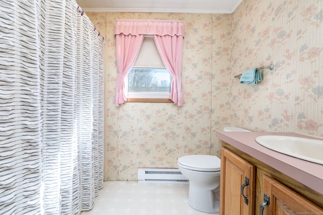 bathroom with vanity, crown molding, a baseboard radiator, and toilet