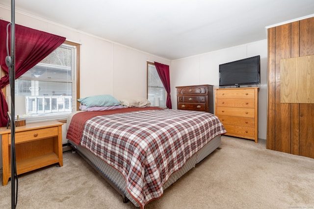 carpeted bedroom with ornamental molding