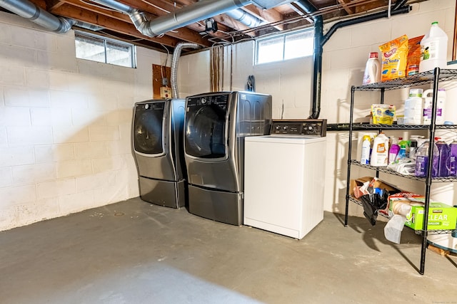 clothes washing area featuring washing machine and clothes dryer