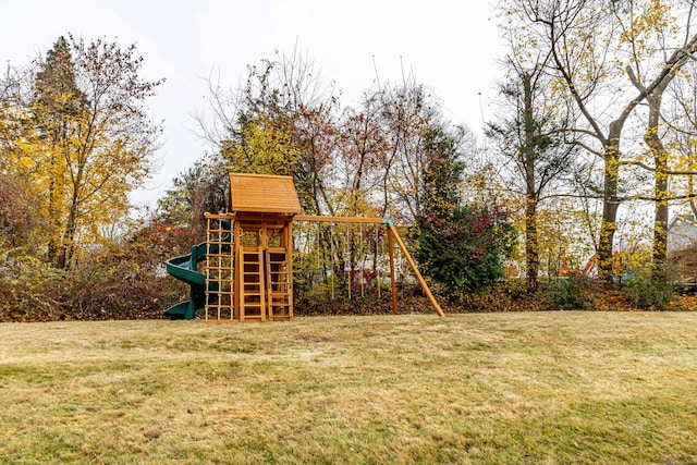 view of jungle gym featuring a lawn