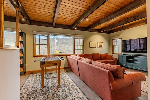 living room featuring beamed ceiling, track lighting, light wood-type flooring, and wooden ceiling