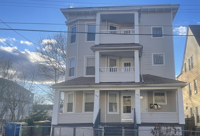 view of front of home featuring covered porch and a balcony