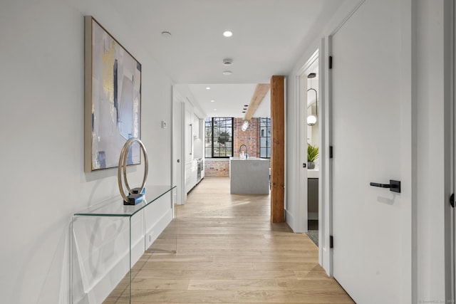 corridor featuring light hardwood / wood-style floors