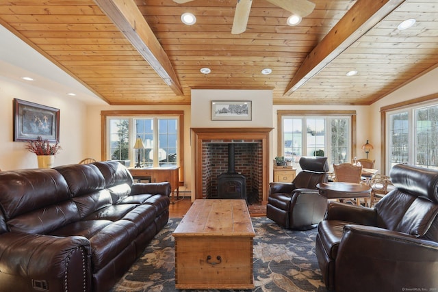 living room featuring wood ceiling, dark hardwood / wood-style floors, lofted ceiling with beams, and a wood stove