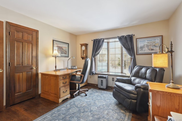 home office with dark hardwood / wood-style flooring