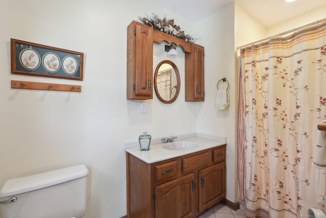 bathroom with vanity, tile patterned floors, toilet, and a shower with shower curtain