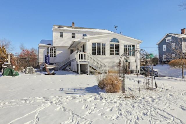 view of snow covered house