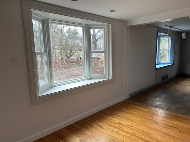 empty room with wood-type flooring