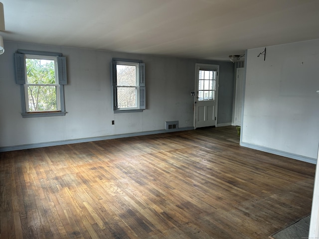 spare room with dark hardwood / wood-style flooring