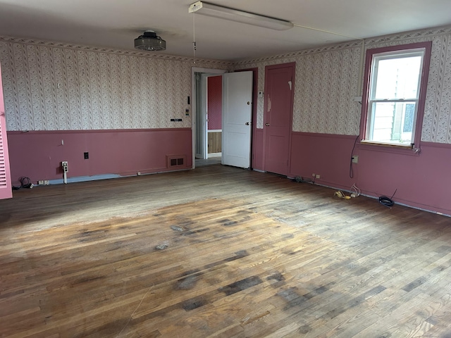 128 Main St S, Bridgewater, CT 06752 - empty room with wallpapered walls and wood finished floors