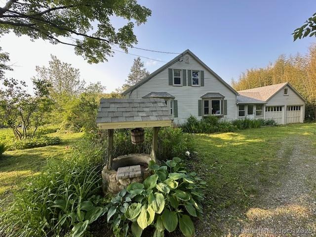 128 Main St S, Bridgewater, CT 06752 - rear view of house with an attached garage