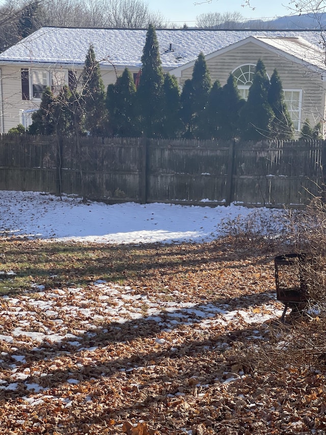 view of yard covered in snow