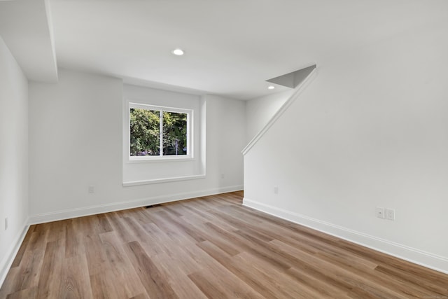 empty room with light hardwood / wood-style floors