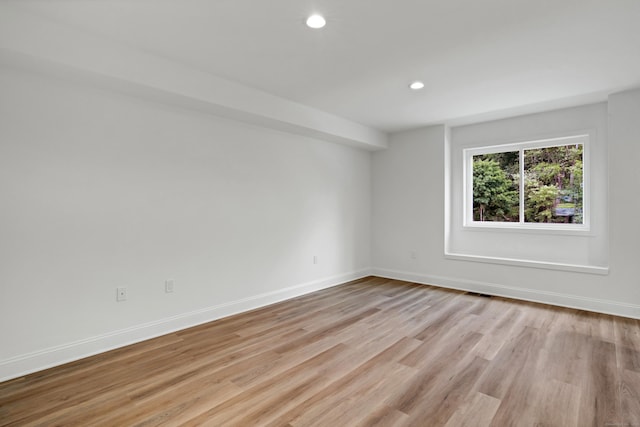 empty room with light wood-type flooring