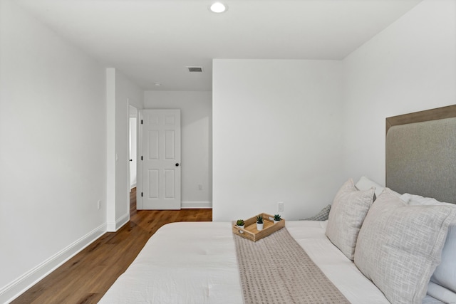 bedroom with hardwood / wood-style floors