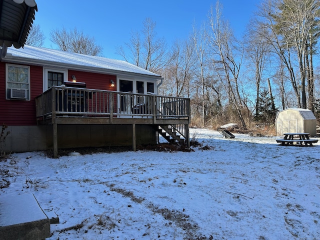 exterior space featuring a storage unit, cooling unit, and a wooden deck