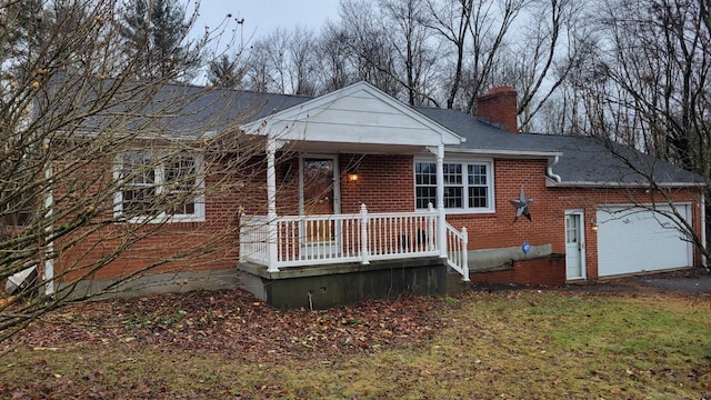 view of front of house featuring covered porch and a garage