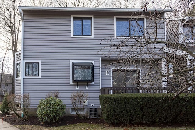 back of property featuring central AC unit